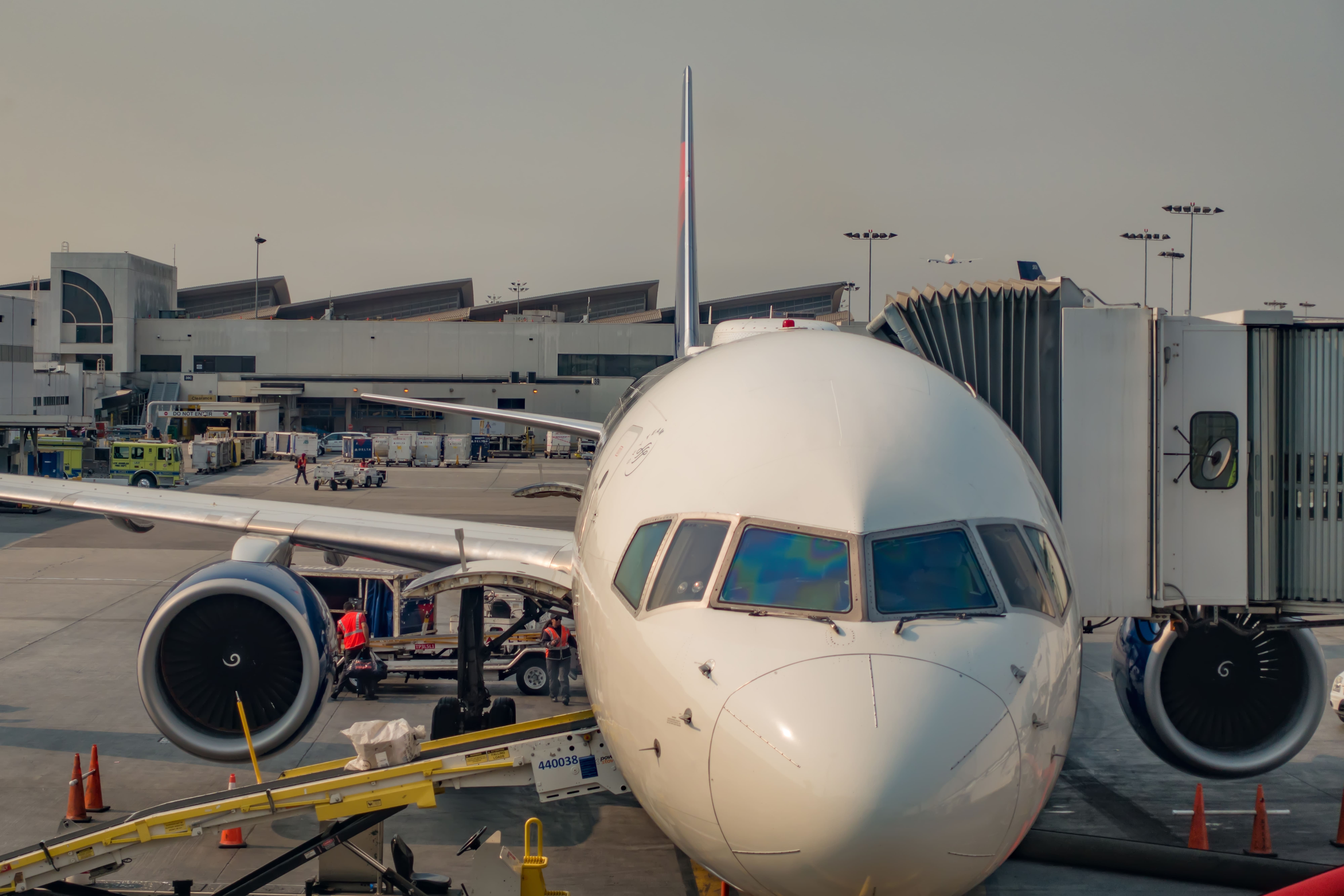 Air travel scene representing a UK travel agency helping travellers book holidays and Umrah packages