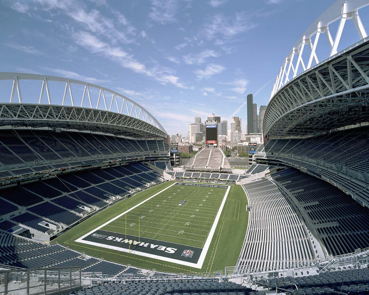 Lumen Field stadium with the Seattle skyline and waterfront in the background